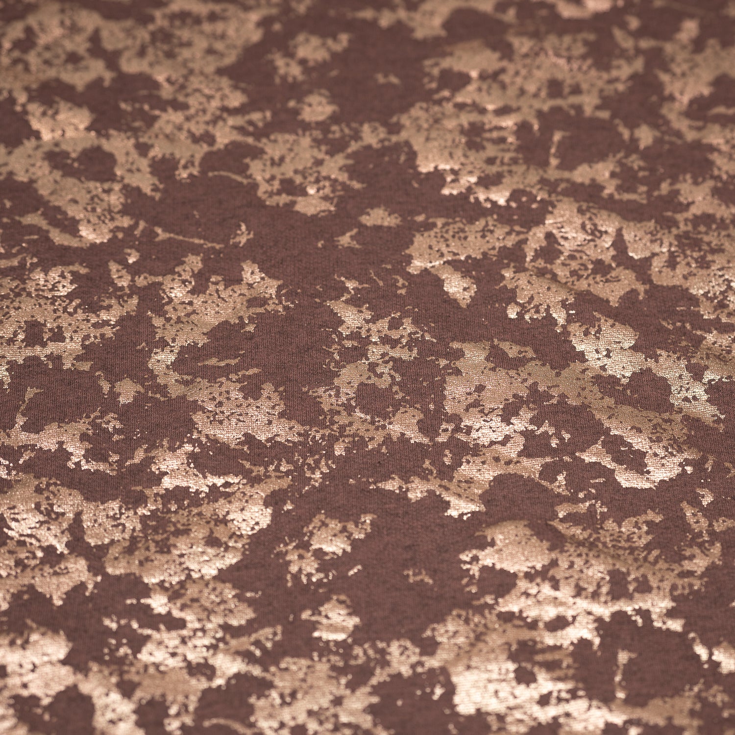 A flat sample of Cloud 9 Foil Printed Brushed Terry Fleece in the color Mauve/Rose Gold