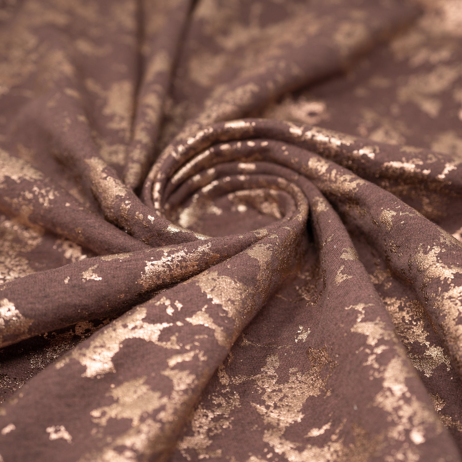 Swirled sample shot of Cloud 9 Foil Printed Brushed Terry Fleece in the color Mauve/Rose Gold