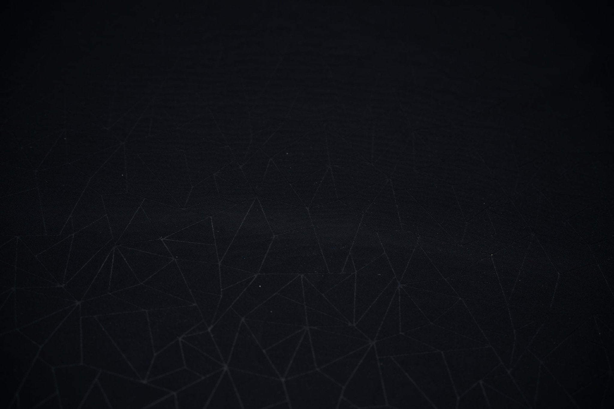 Detailed shot of Geometric Embossed Matte Spandex Tricot in Black.