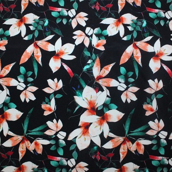 A flat sample of floral vines printed spandex.
