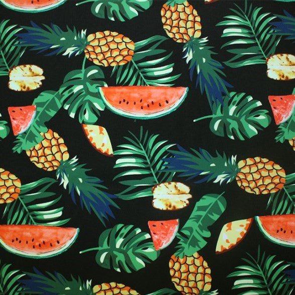 A flat sample of fruity leaves printed spandex.