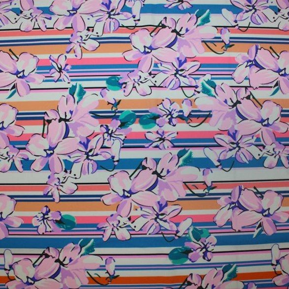 A flat sample of flowers on stripes printed spandex.