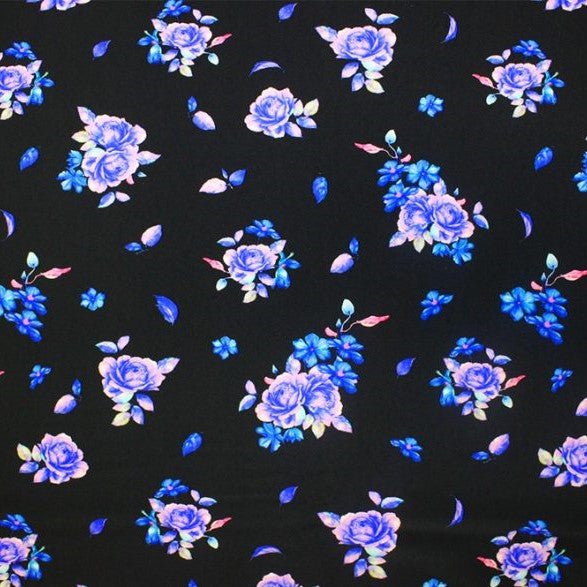 A flat sample of blue rose printed spandex.