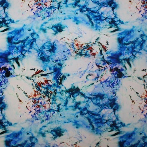 A flat sample of tie-dye volcano printed spandex,
