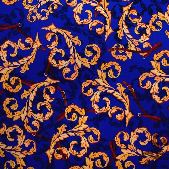 A flat sample of vintage gold paisley printed spandex.