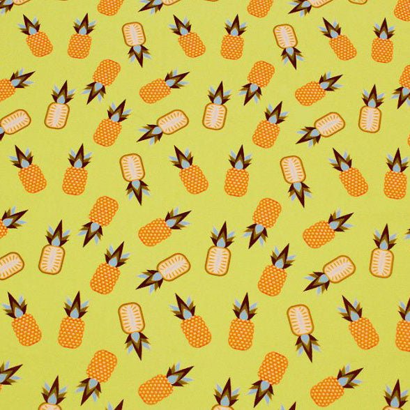 A flat sample of hawaii pinepple party printed spandex.