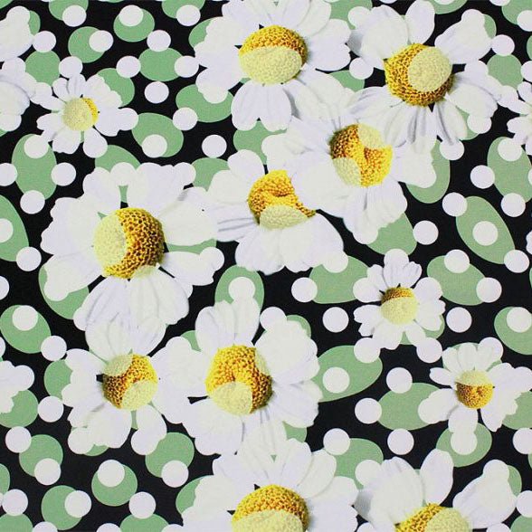 A flat sample of dotted daisies printed spandex.