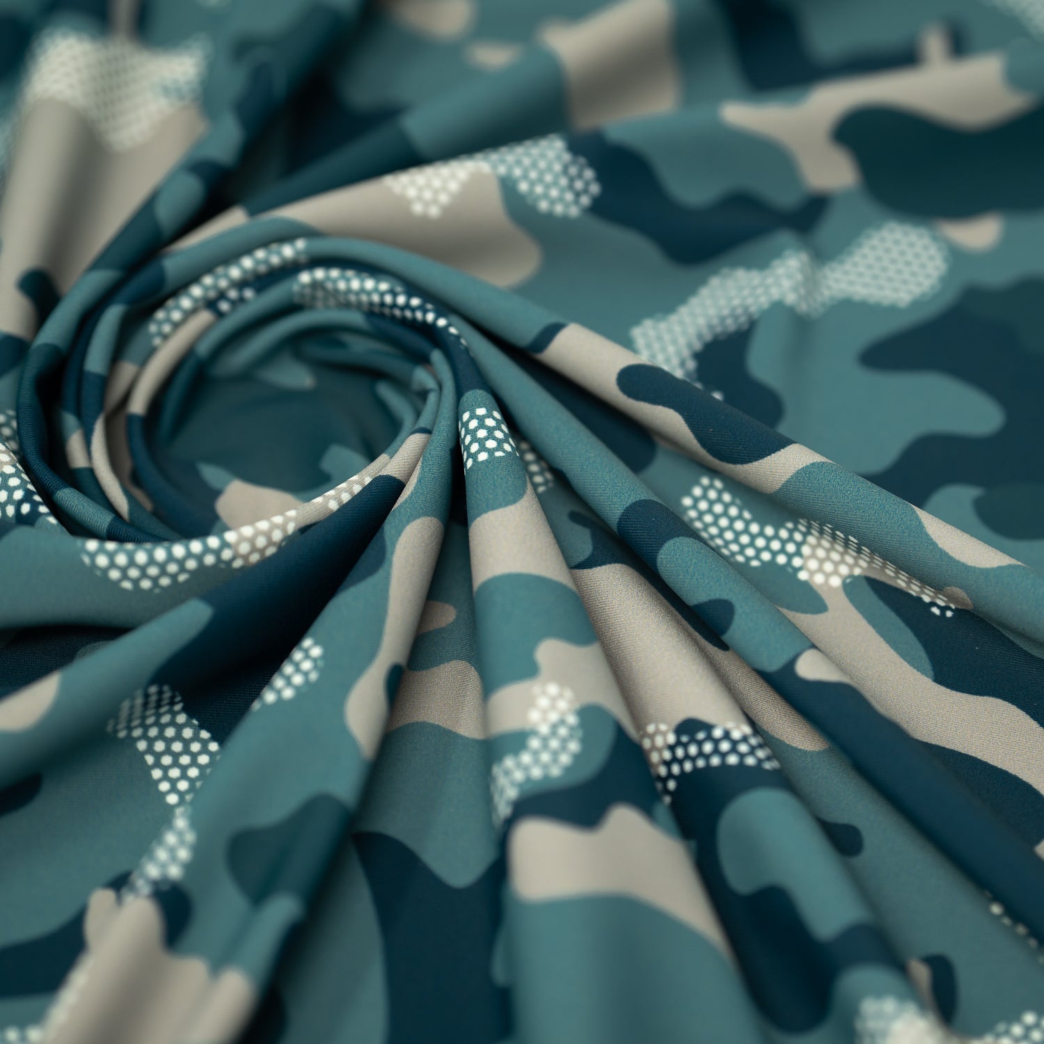 Swirled sample shot of Fiji Camouflage Printed Spandex in the color navy-blue-white-brown