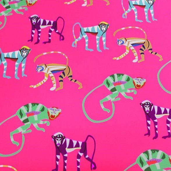 A flat sample of pink monkey printed spandex.