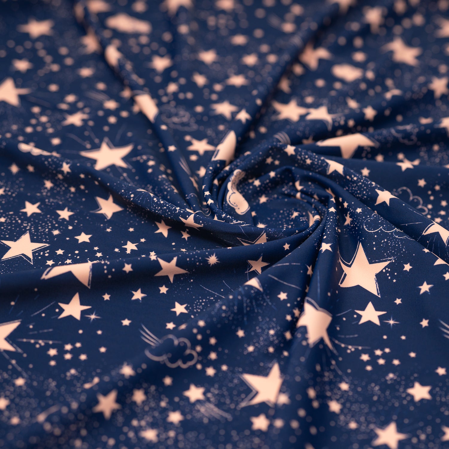 Swirled piece of Star Bright Printed Spandex fabric.