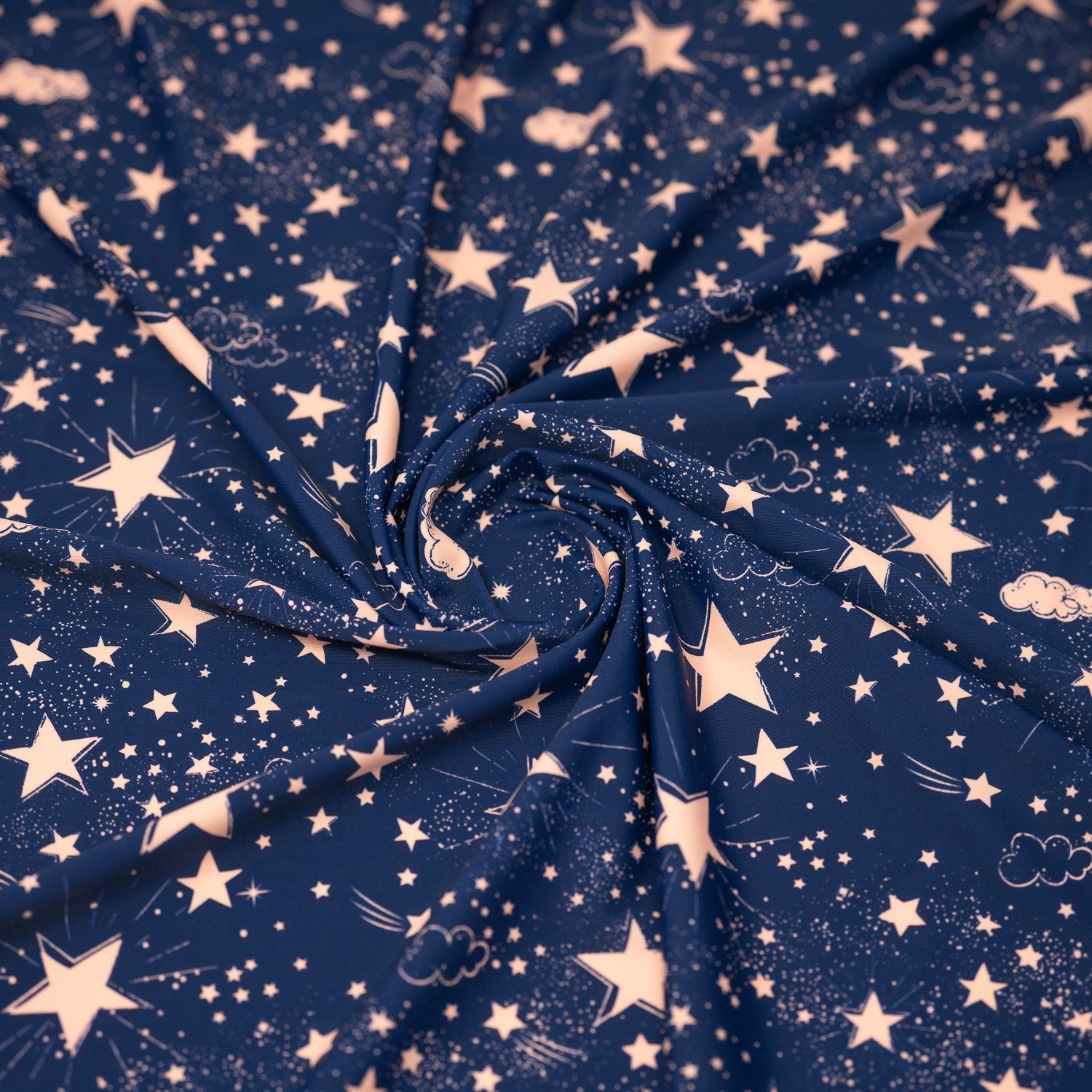 Swirled piece of Star Bright Printed Spandex fabric.