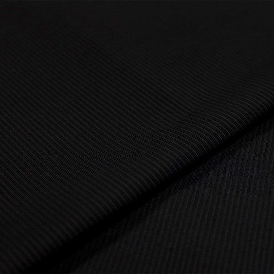 A sample of Wander Textured Nylon Spandex Fabric in Black.
