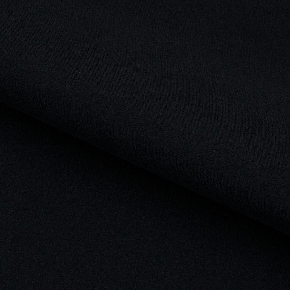A sample of Elite Brushed Polyester Lycra Tricot Fabric in color black.