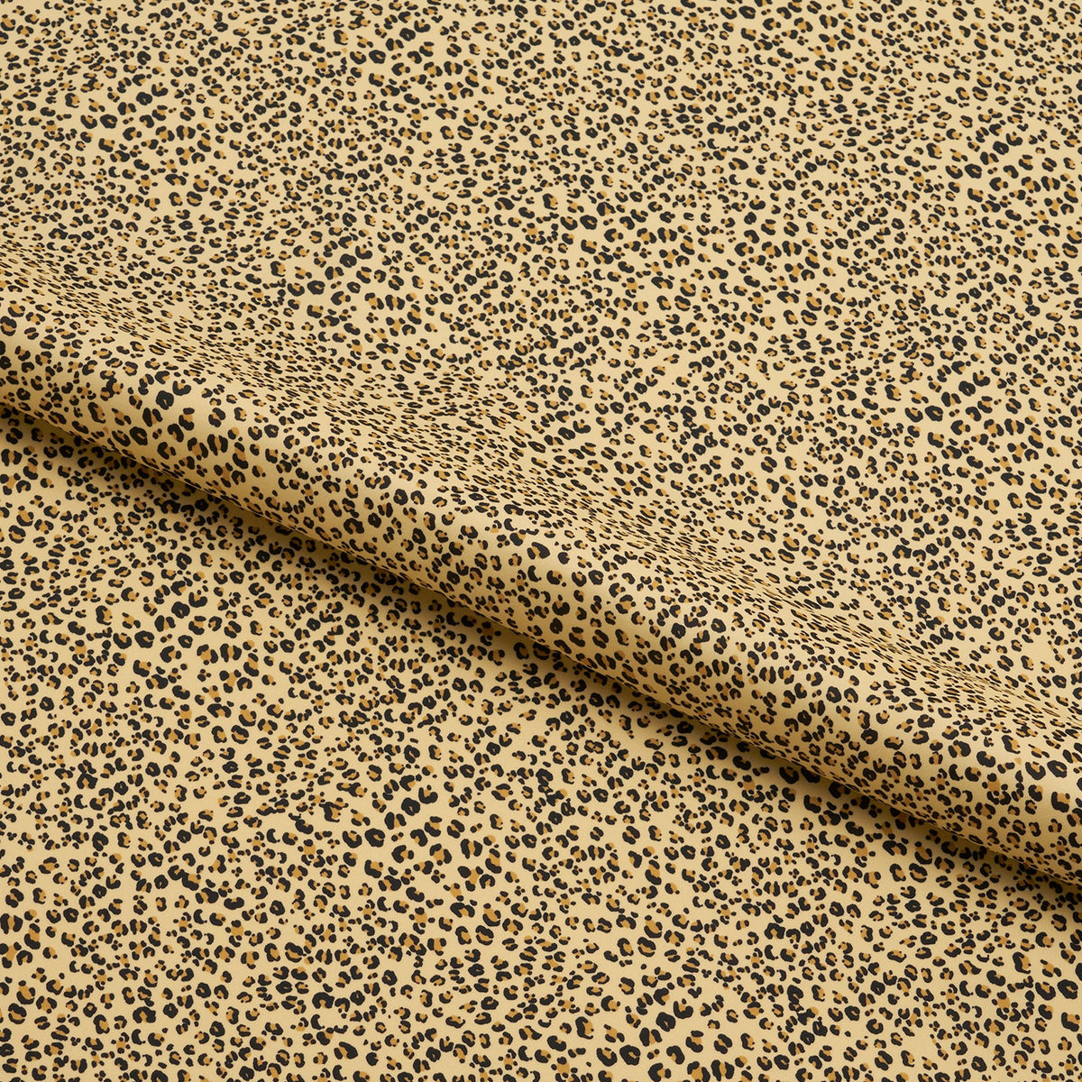 A yard of baby cheetah pattern printed spandex fabric displaying a beige ground color with a small black cheetah print.