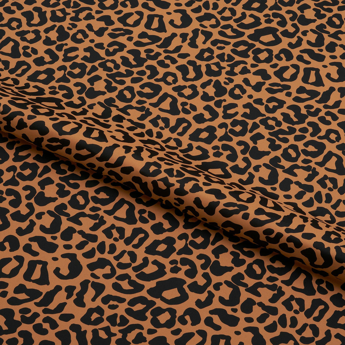 A sample piece of Groove Leopard Pattern Printed Spandex Fabric.