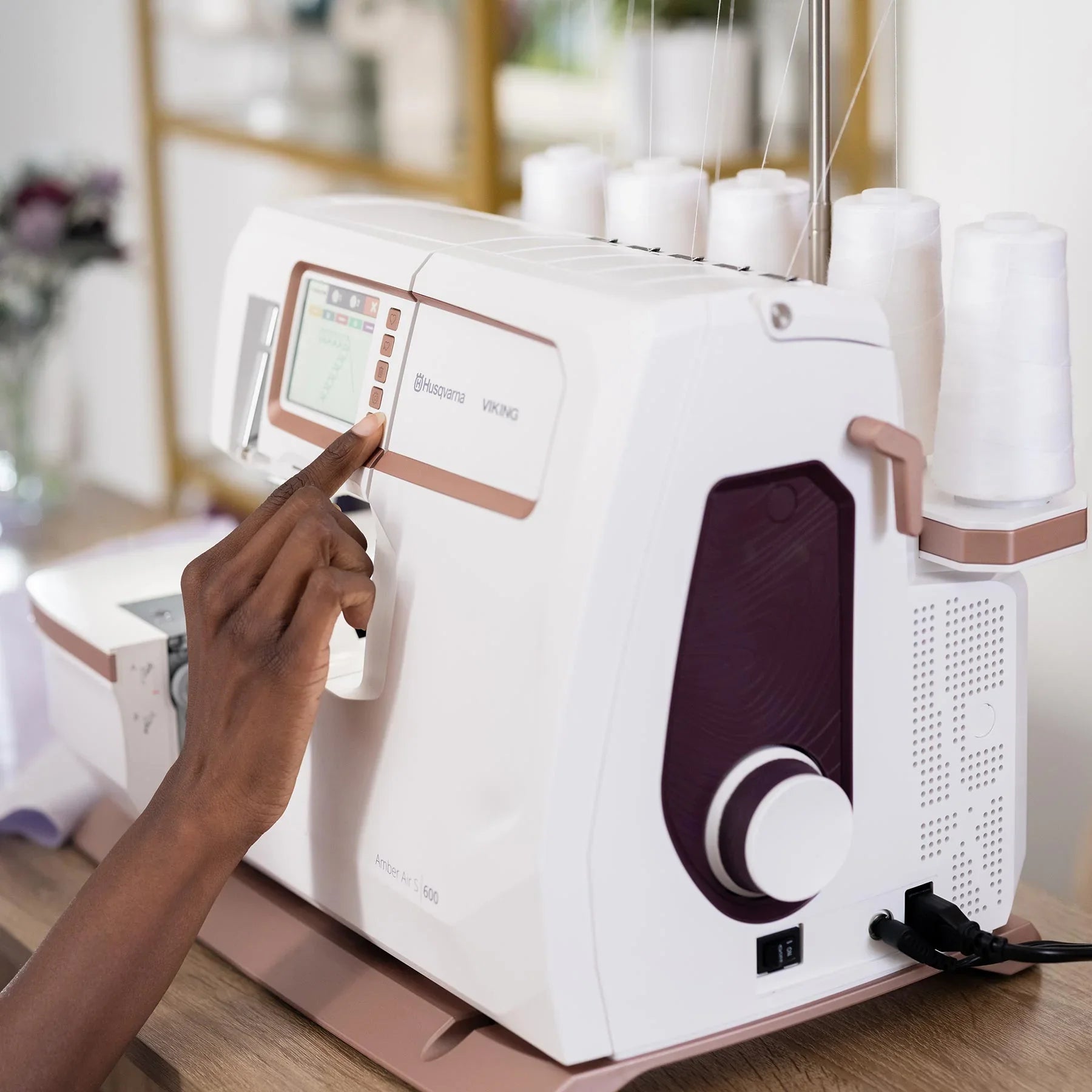 A sample of HUSQVARNA VIKING AMBER Air S | 600 Coverlock Machine.