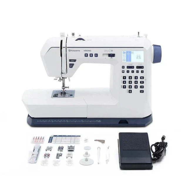 A complete set of HUSQVARNA VIKING ONYX 30 Sewing Machine & Accessories.
