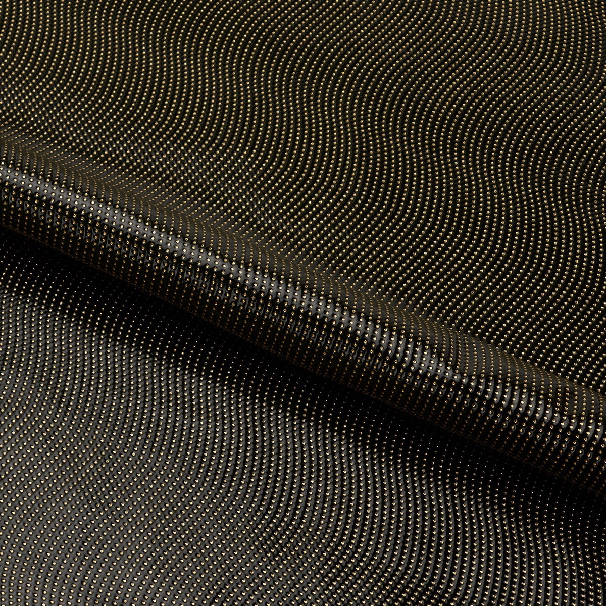 A dotted piece of Hipster Swirl PU Coated Spandex Fabric in color black/gold.