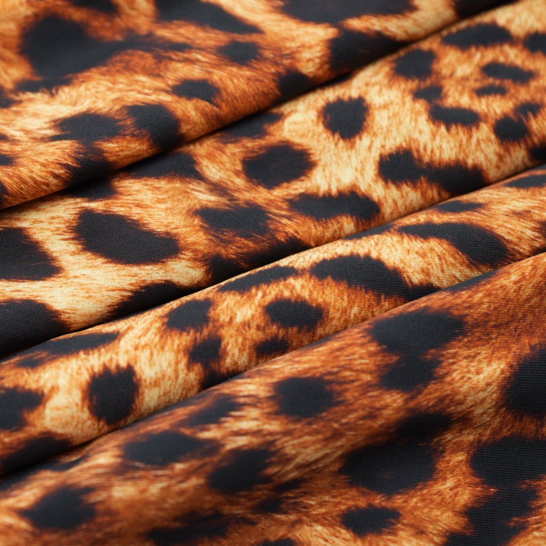A sample piece of Leopard Spotted Safari Printed Spandex Fabric.