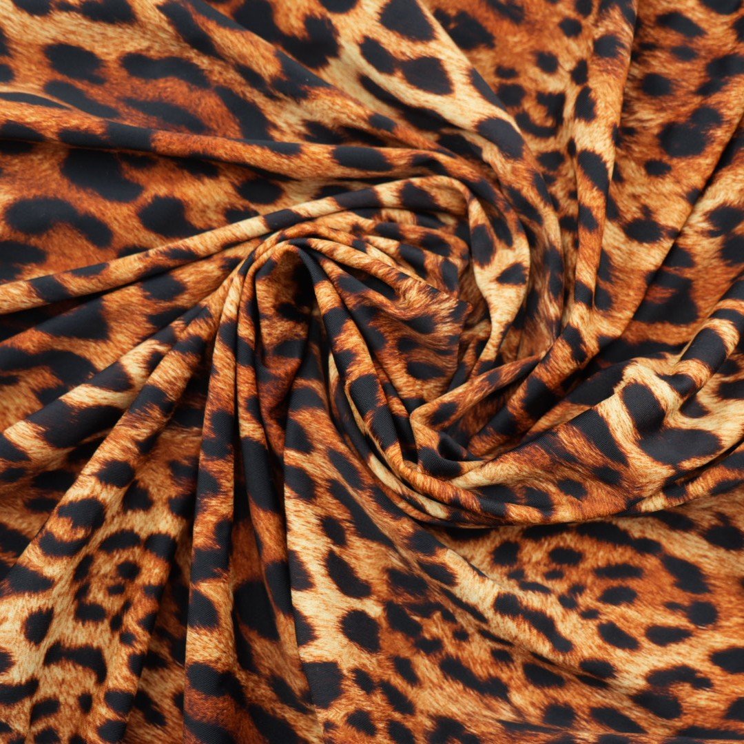 A sample piece of Leopard Spotted Safari Printed Spandex Fabric.