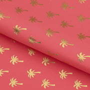 A foiled piece of Palm Trees Foil In Pink Printed Spandex Fabric in color gold/pink.