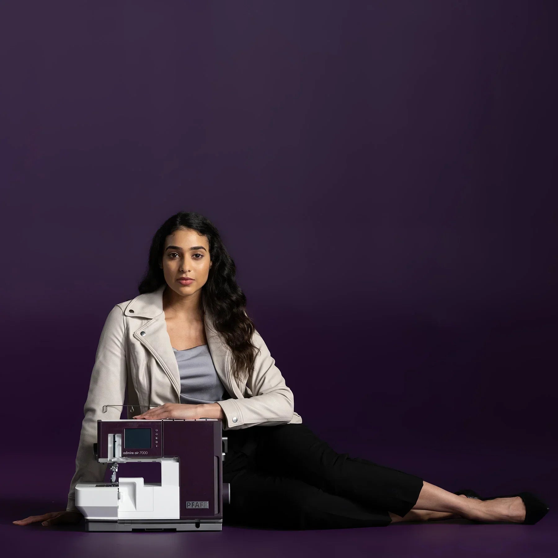 A sample of PFAFF® admire™ air 7000 Purple Coverlock Machine.