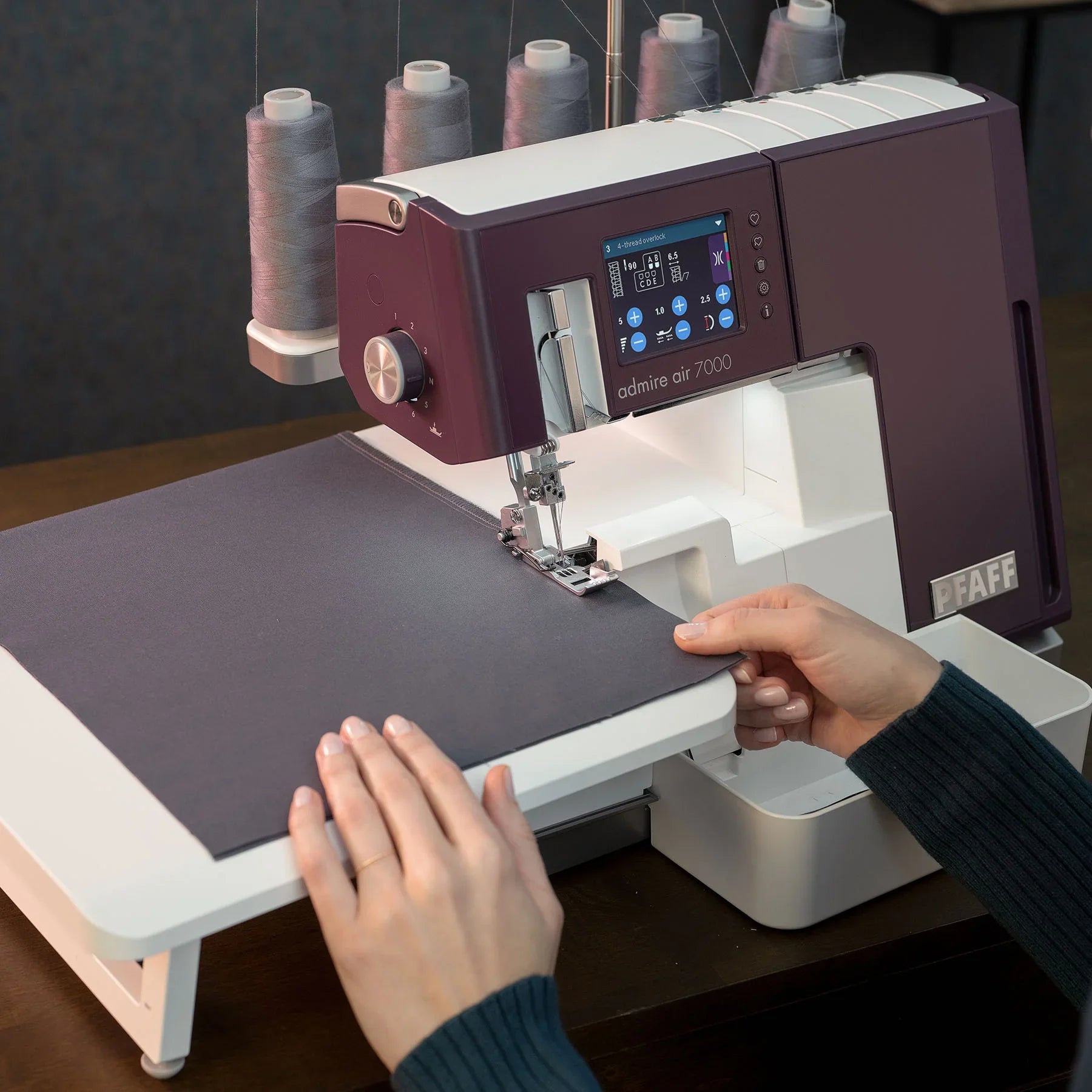 A sample of PFAFF® admire™ air 7000 Purple Coverlock Machine.