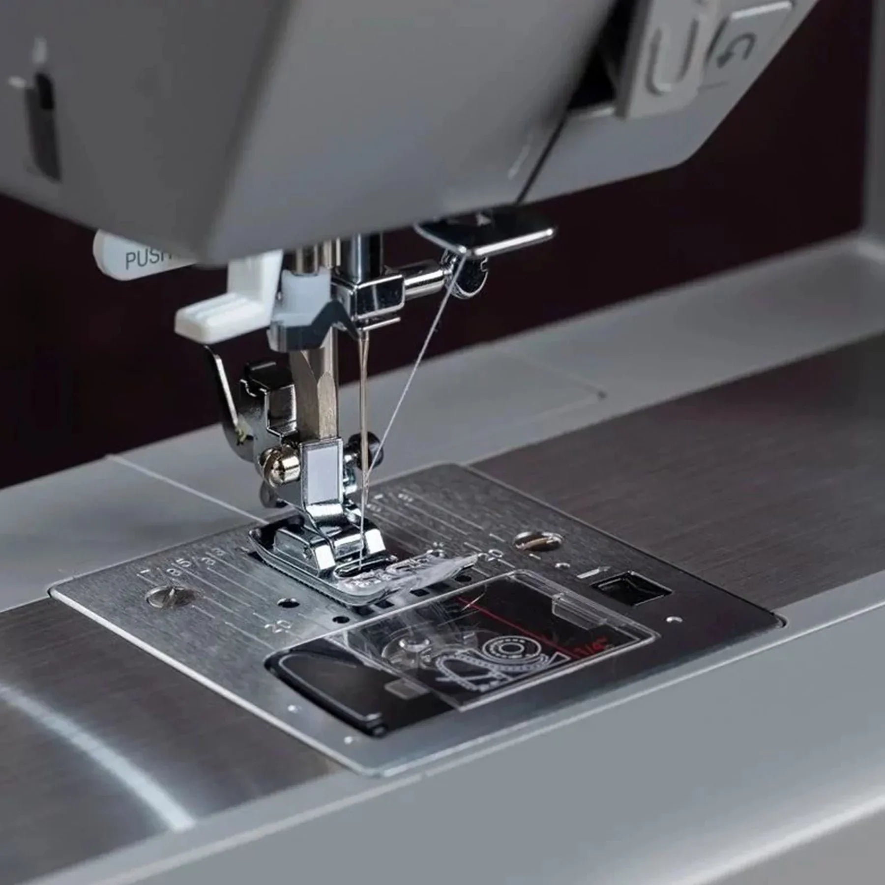 Close-up photo showing the needle threader of the Singer Heavy Duty 6620C Sewing Machine.