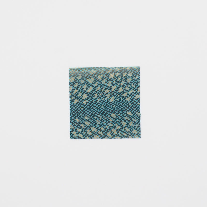 Close-up video of Venomous Foil Printed Stretch Velvet in color turquoise showcasing its looks and ability to stretch as a fabric.