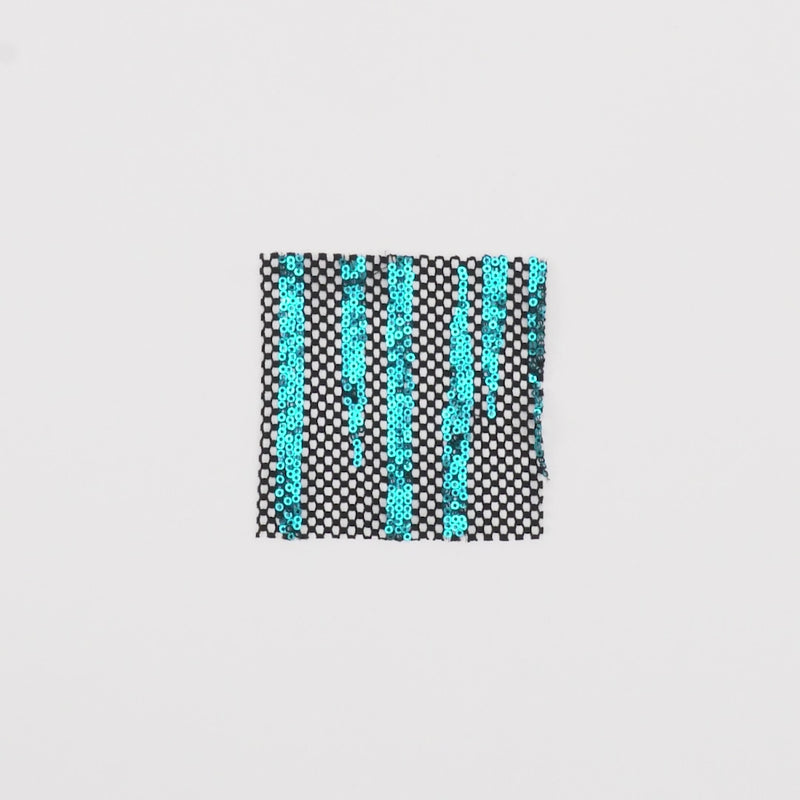 Close-up video of Flair Stretch Mesh Sequin fabric showcasing its looks and ability to stretch as a fabric.