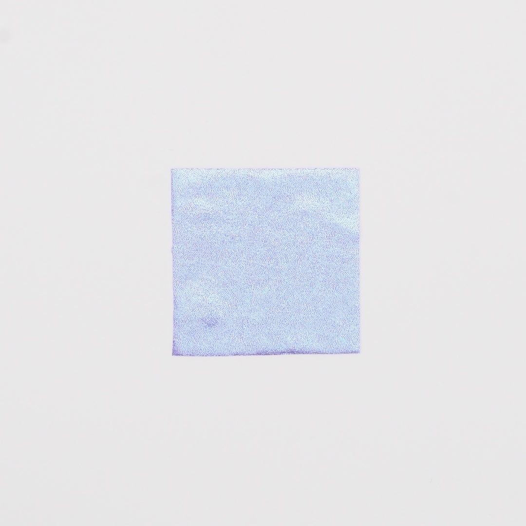 Load video: Close-up video of Mystique Foiled Spandex Fabric in color Lilac/Baby Blue showcasing its looks and ability to stretch as a fabric.