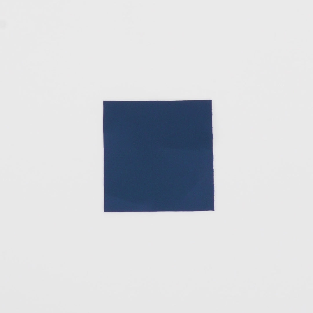 Load video: Close-up video of Spacer Scuba Knit Fabric in color Navy showcasing its looks and ability to stretch as a fabric.