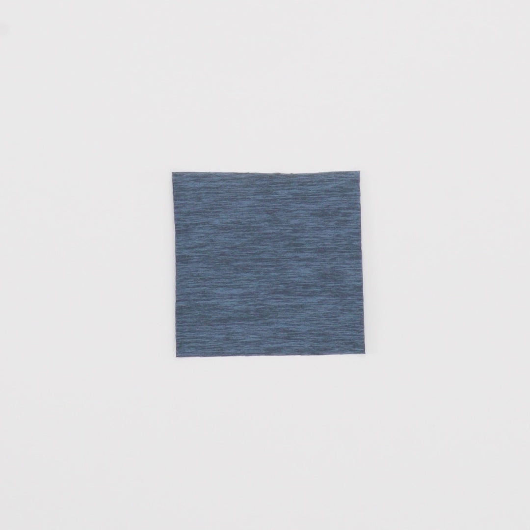 Load video: Close-up video of Eco Delish Double Peached Melange Fabric showcasing its looks and ability to stretch as a fabric.
