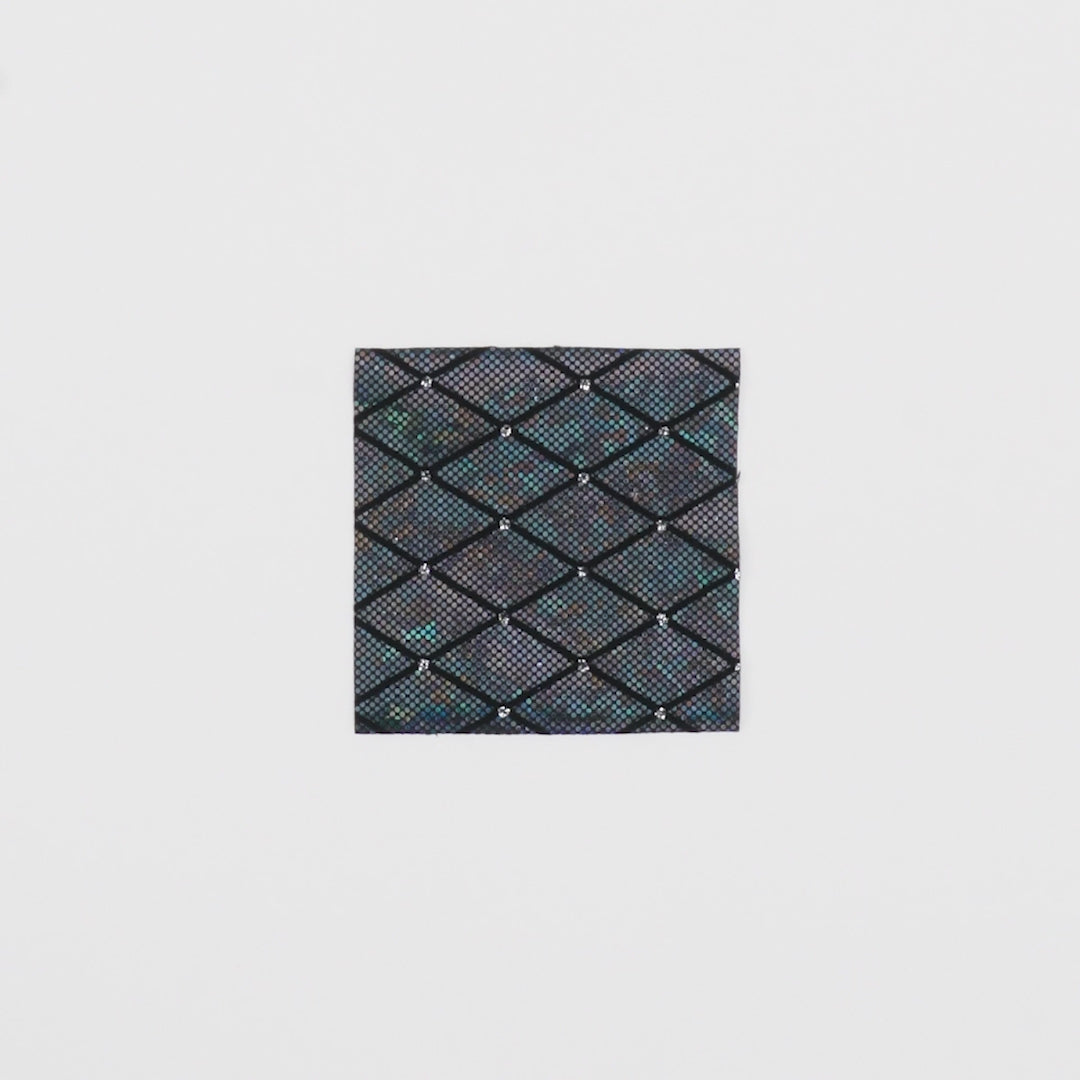 Load video: Close-up video of Argyle Shattered Glass Foiled Spandex Fabric showcasing its looks and ability to stretch as a fabric.
