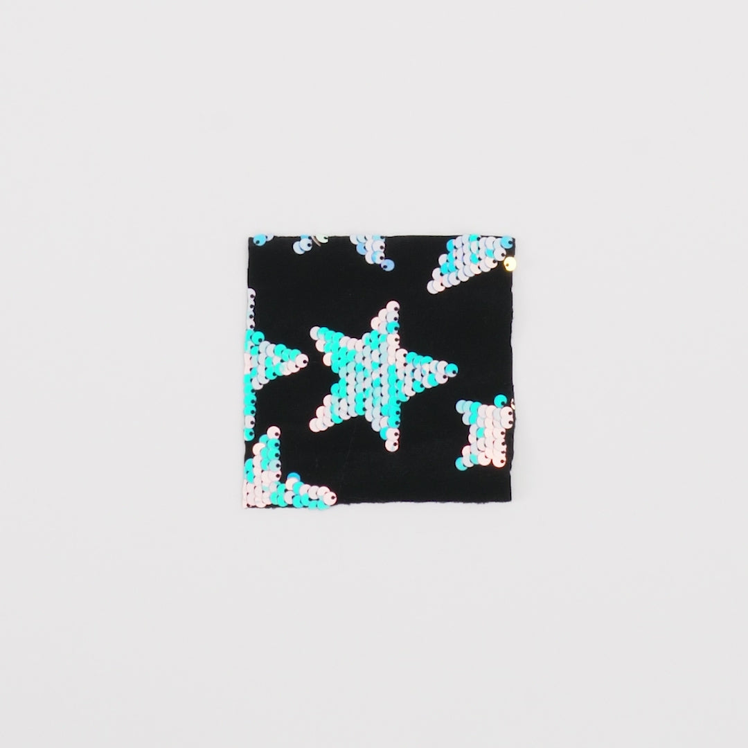 Load video: Close-up video of Starlight Stretch Velvet Flip Sequin showcasing its looks and ability to stretch as a fabric.