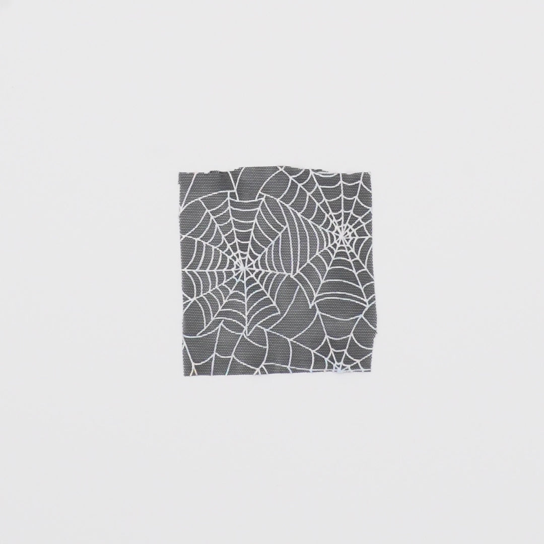 Load video: Close-up video of Spiderweb Foiled Mesh Spandex Fabric showcasing its looks and ability to stretch as a fabric.