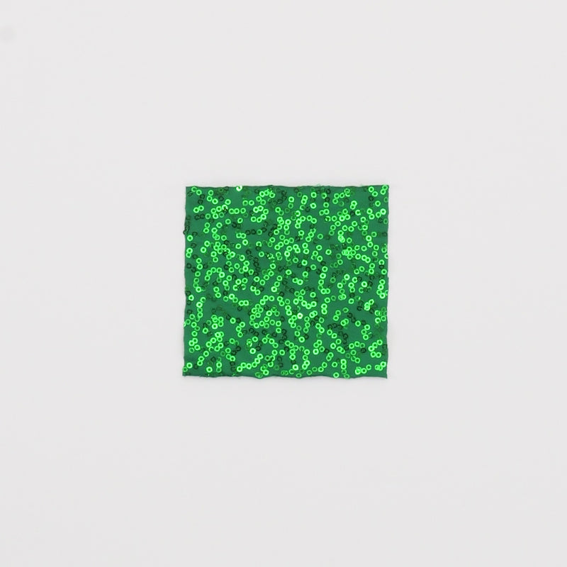 Close-up video of Zsa Zsa Spandex Sequin Fabric in color kelly showcasing its looks and ability to stretch as a fabric.