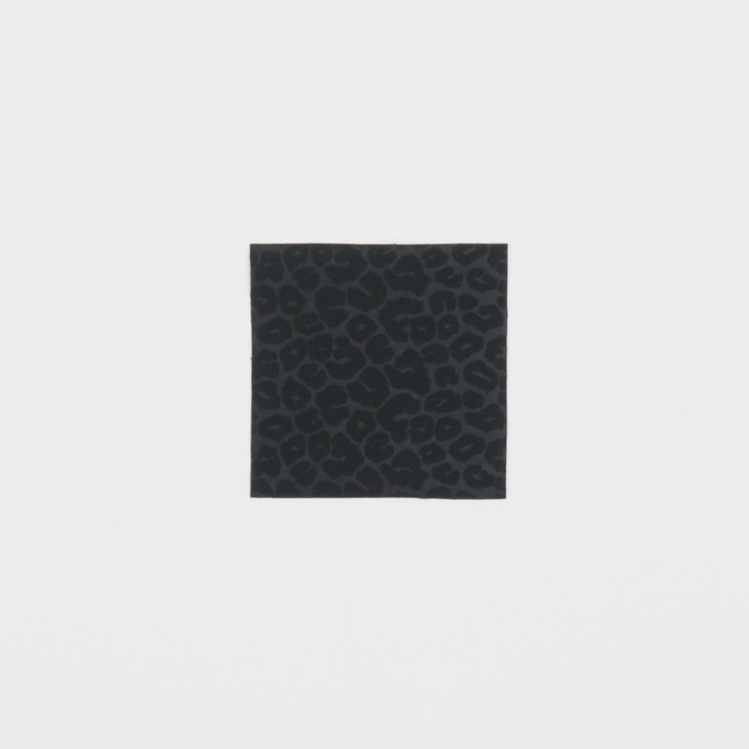 Load video: Close-up video of Nala Embossed Leopard Spandex fabric showcasing its looks and ability to stretch as a fabric.