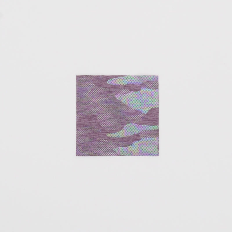 Close-up video of GI Jane Foil Printed EcoDeslish Fabric in color Dusty Lilac/Iridescent showcasing its looks and ability to stretch as a fabric.