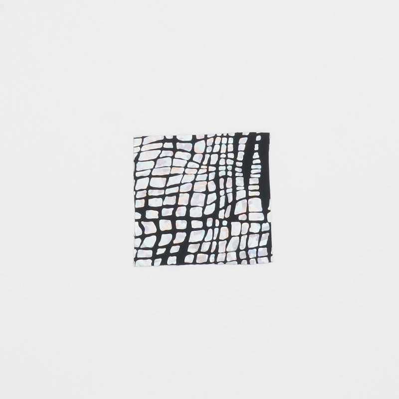 Close-up video of Disco Croc Fabric showcasing its looks and ability to stretch as a fabric.