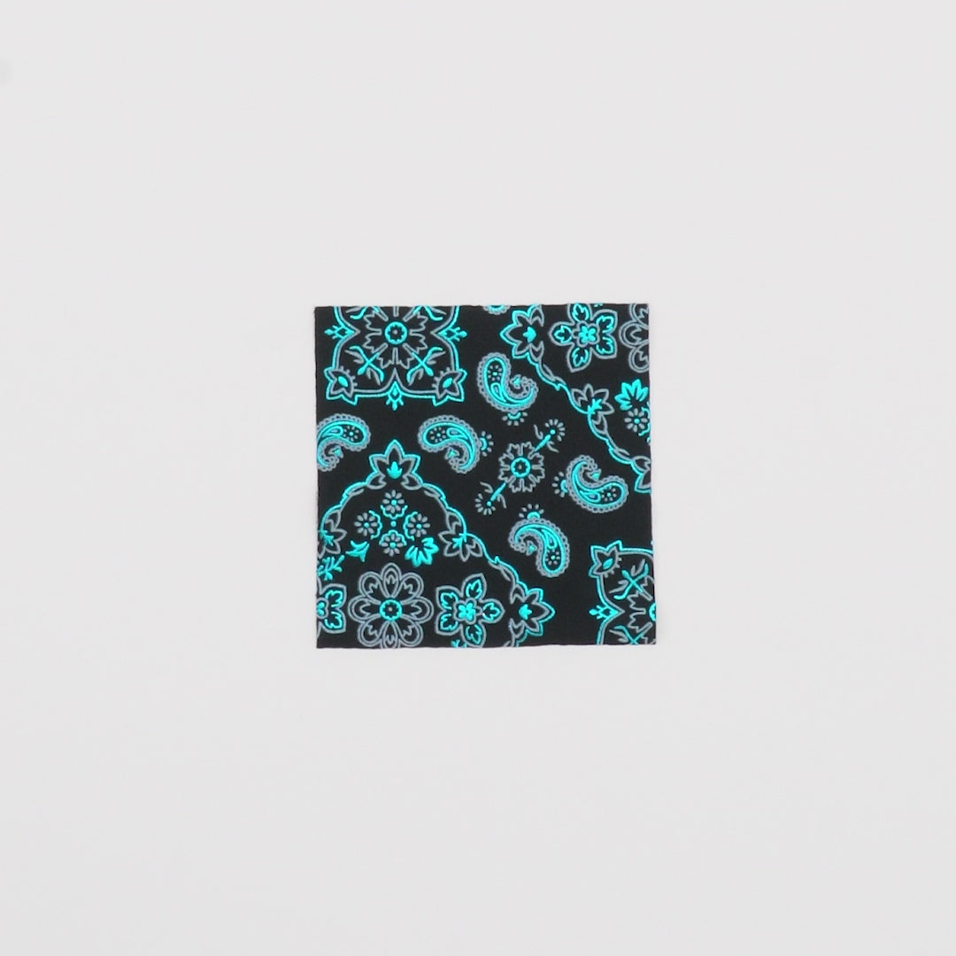 Load video: Close-up video of Bandana Foil Printed Spandex Fabric showcasing its looks and ability to stretch as a fabric.