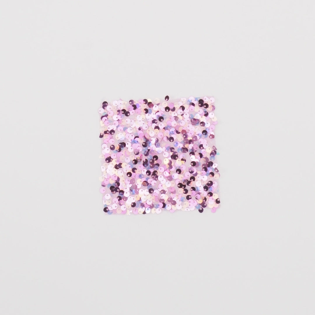 Load video: Close-up video of belle stretch mesh sequin fabric showcasing its looks and ability to stretch as a fabric.