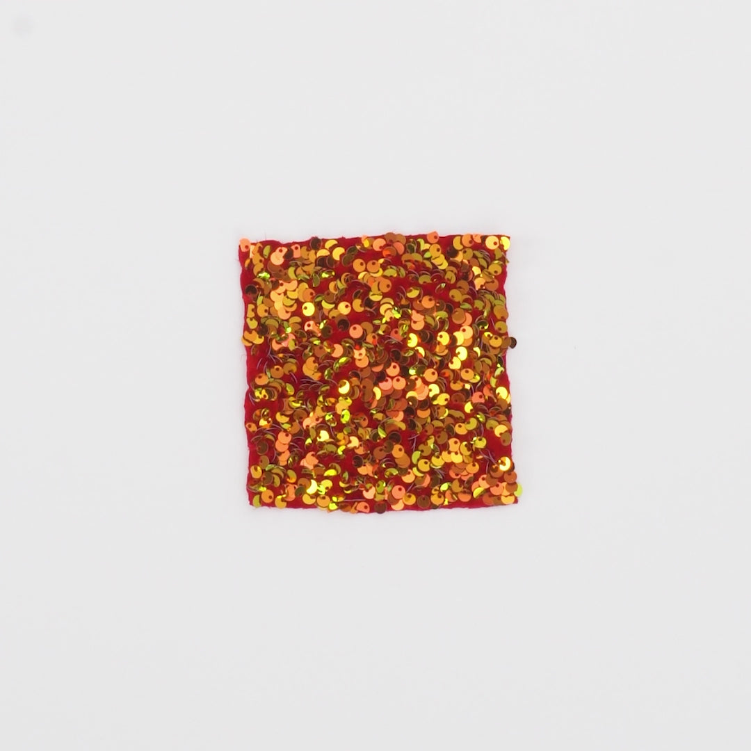 Load video: Close-up video of Duchess Stretch Velvet Sequin Fabric in color Red/Iridescent Red showcasing its looks and ability to stretch as a fabric.