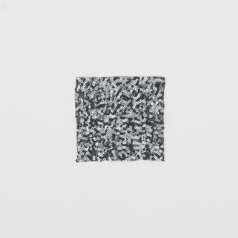 Close-up video of Cosmic 4-Way Stretch Sequin on Spandex Fabric in color Gunmetal showcasing its looks and ability to stretch as a fabric.