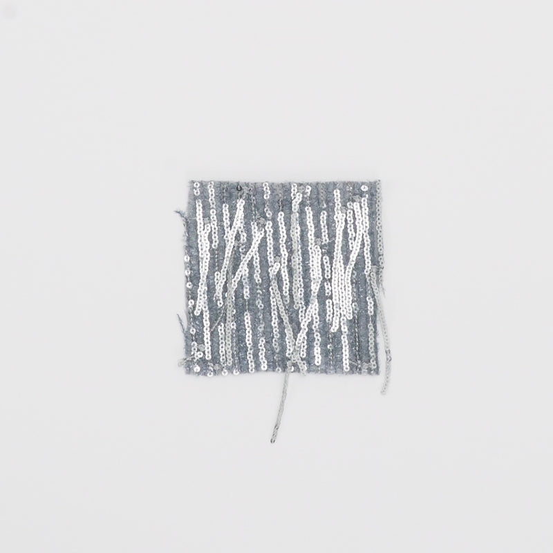 Close-up video of shimmer polyester Mesh with dangle sequin fabric showcasing its looks and ability to stretch as a fabric.