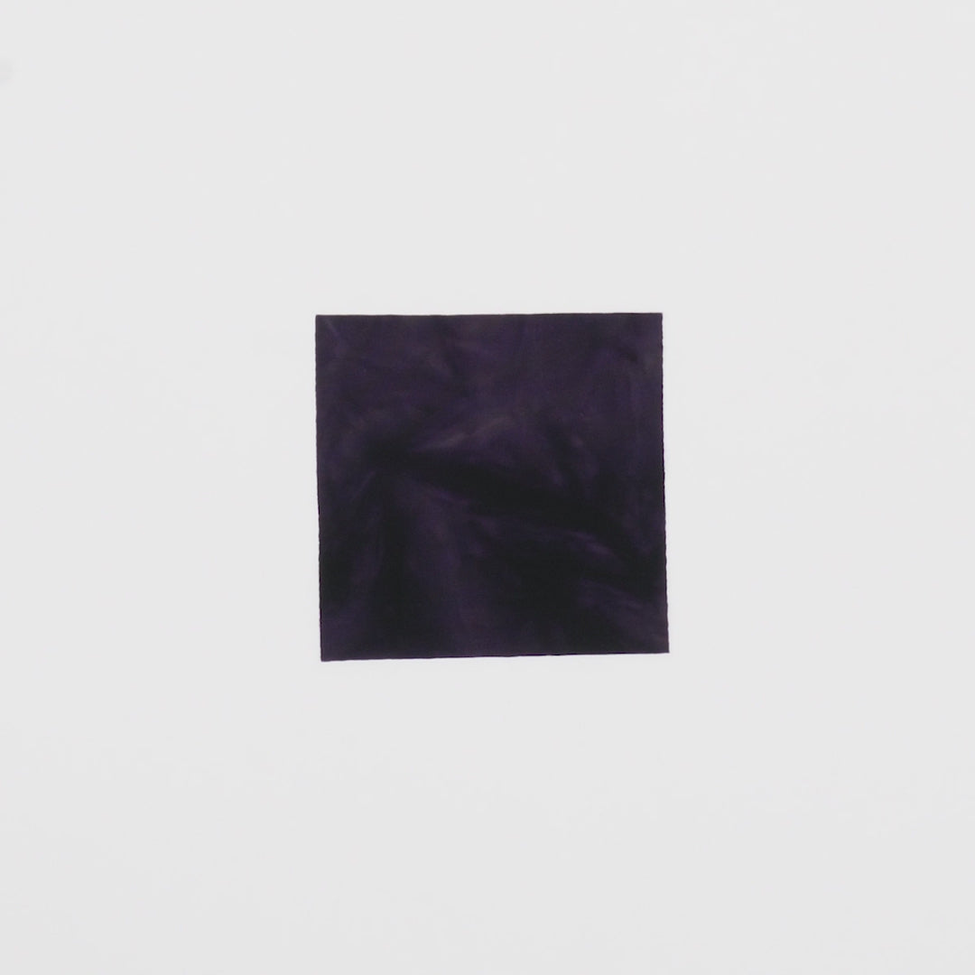 Load video: Close-up video of Tempest Tie Dye Spandex Fabric in color eggplant showcasing its looks and ability to stretch as a fabric.