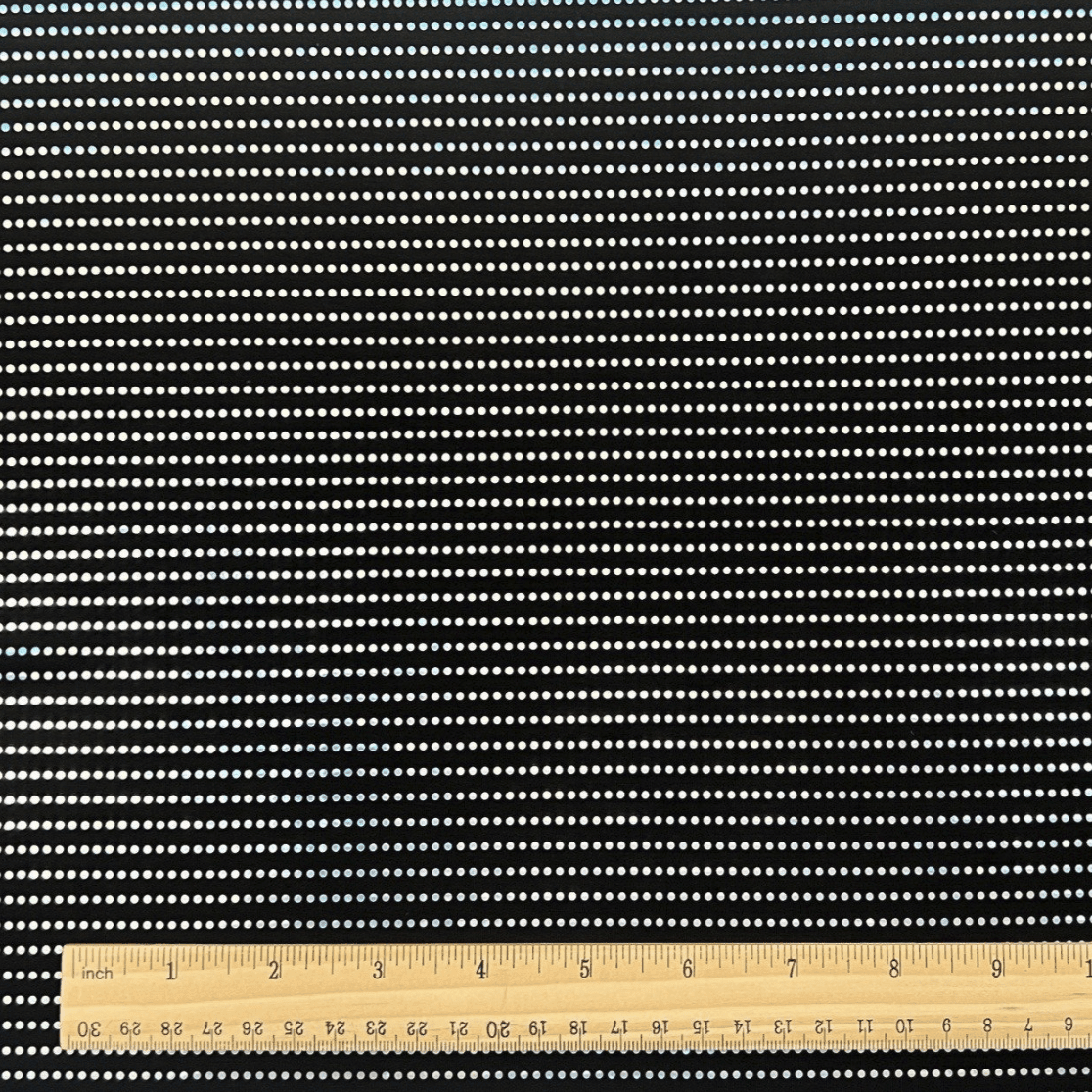 Water fall Spandex fabric with a ruler at the bottom shows the scale.