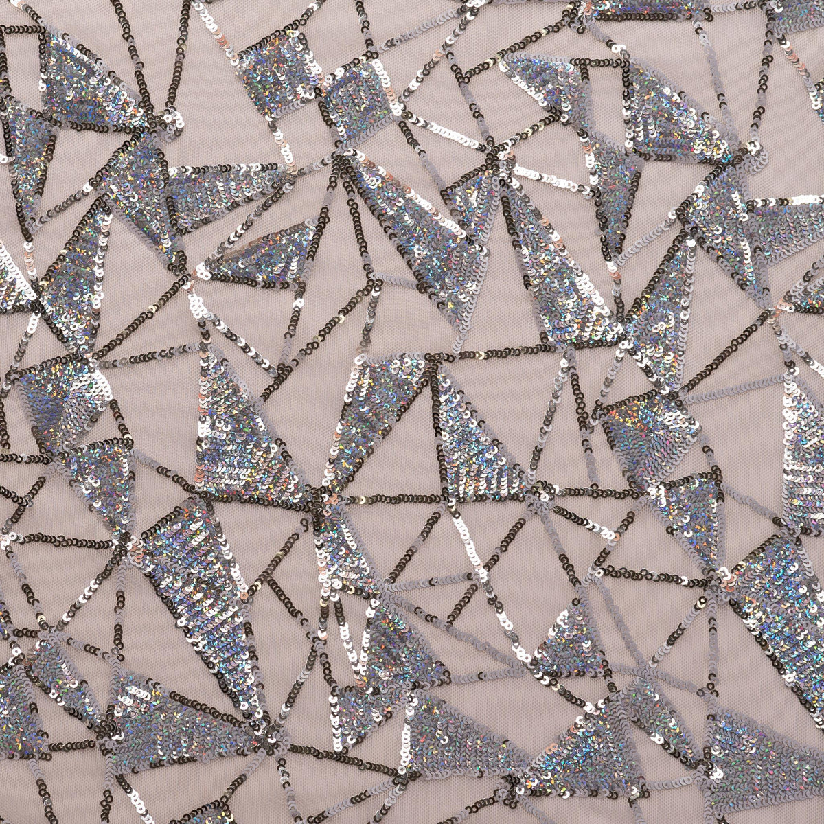 A flat sample of Flaunt It Stretch Mesh Sequin with nude colored mesh and silver sequin.