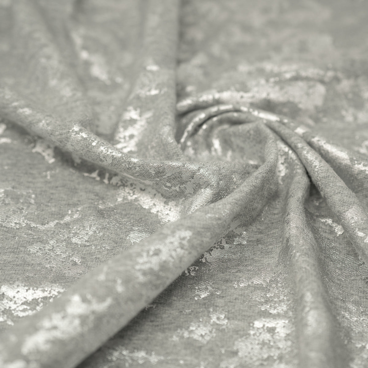 Swirled sample shot of Cloud 9 Foil Printed Brushed Terry Fleece in the color Gray/Silver