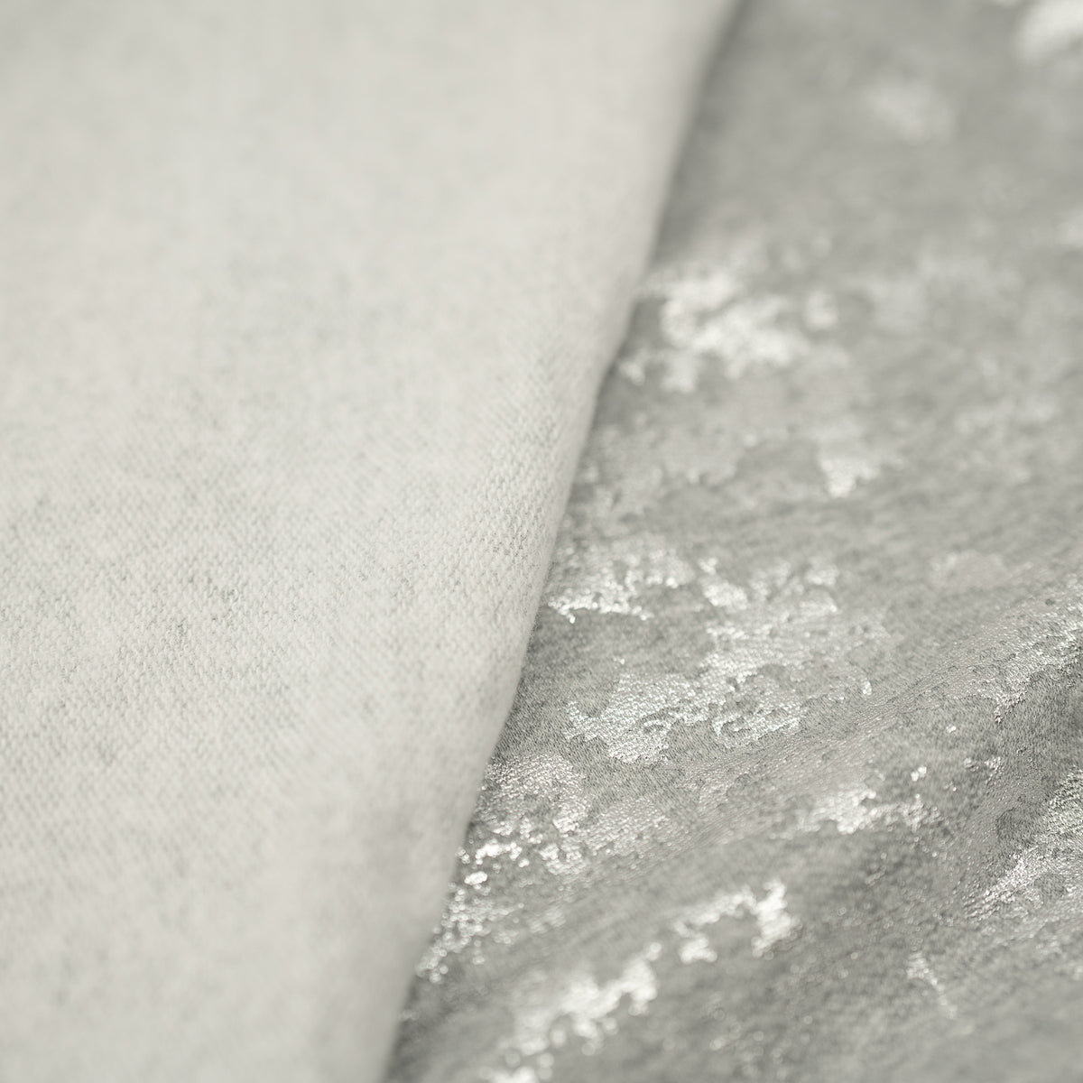 Detailed shot of Cloud 9 Foil Printed Brushed Terry Fleece in the color Gray/Silver
